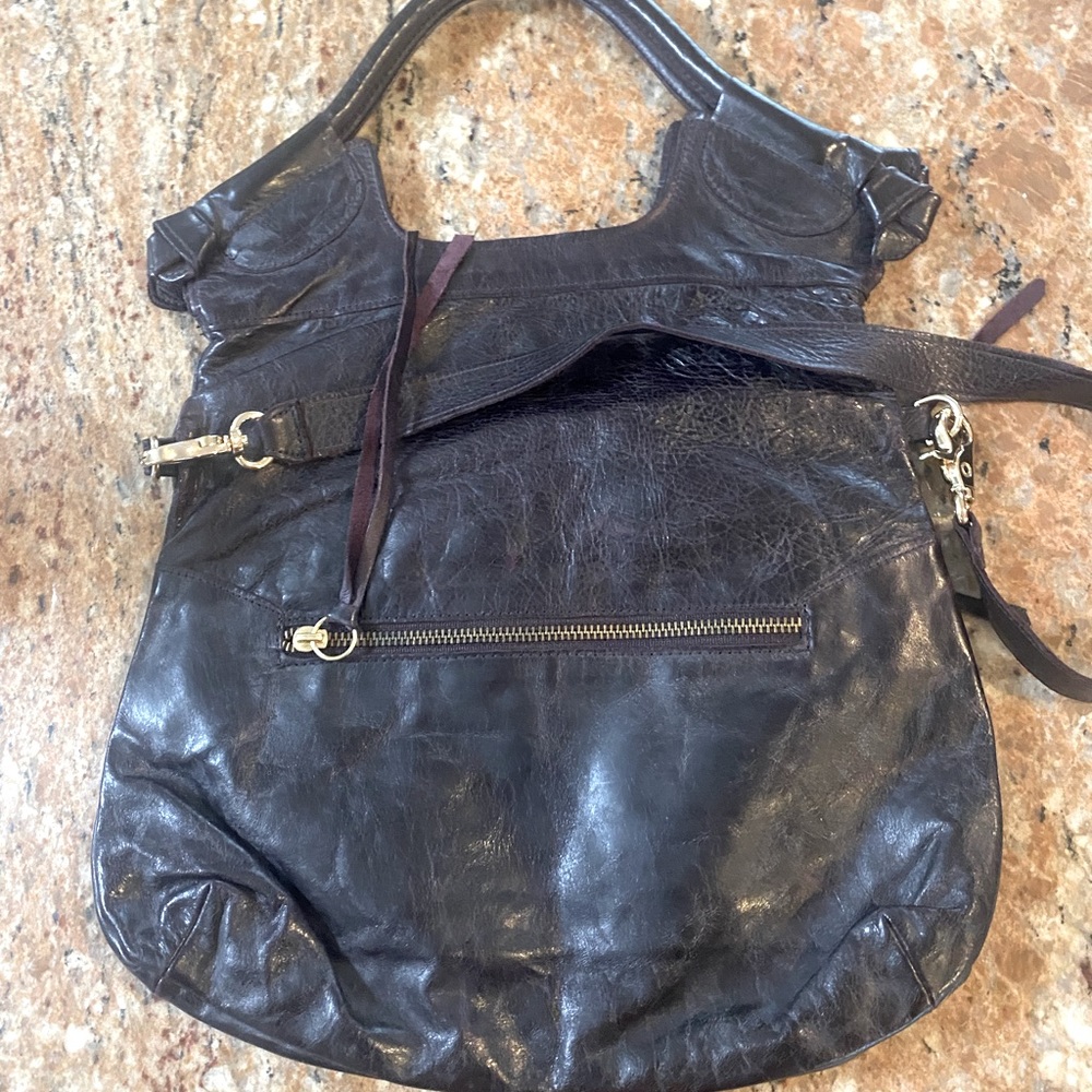 Cute clutch or crossbody, plenty of pockets. Hale Barry loves to rock this bag.